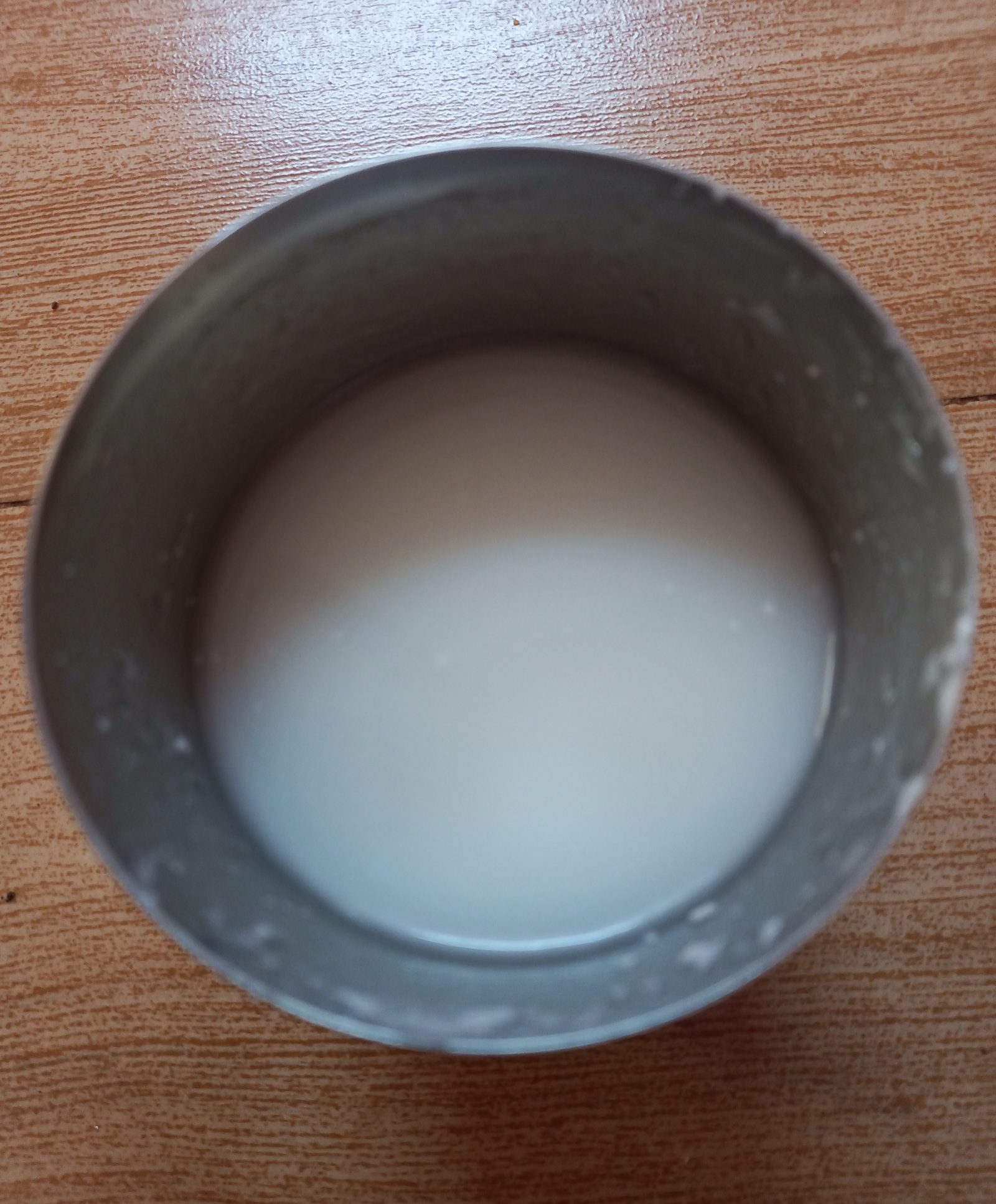 A glass of buttermilk on a table