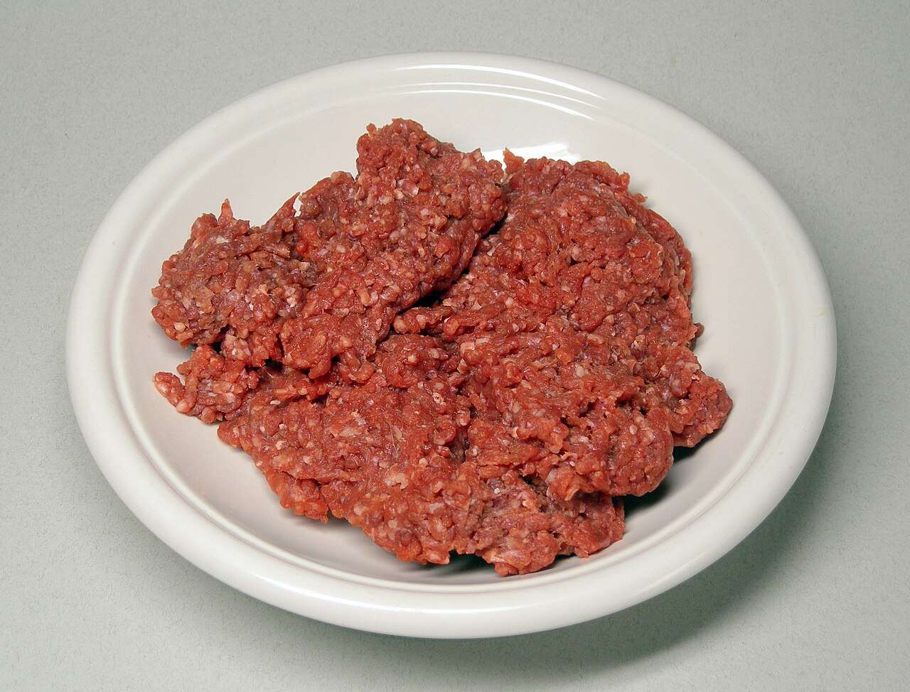 Fresh raw minced beef on a board