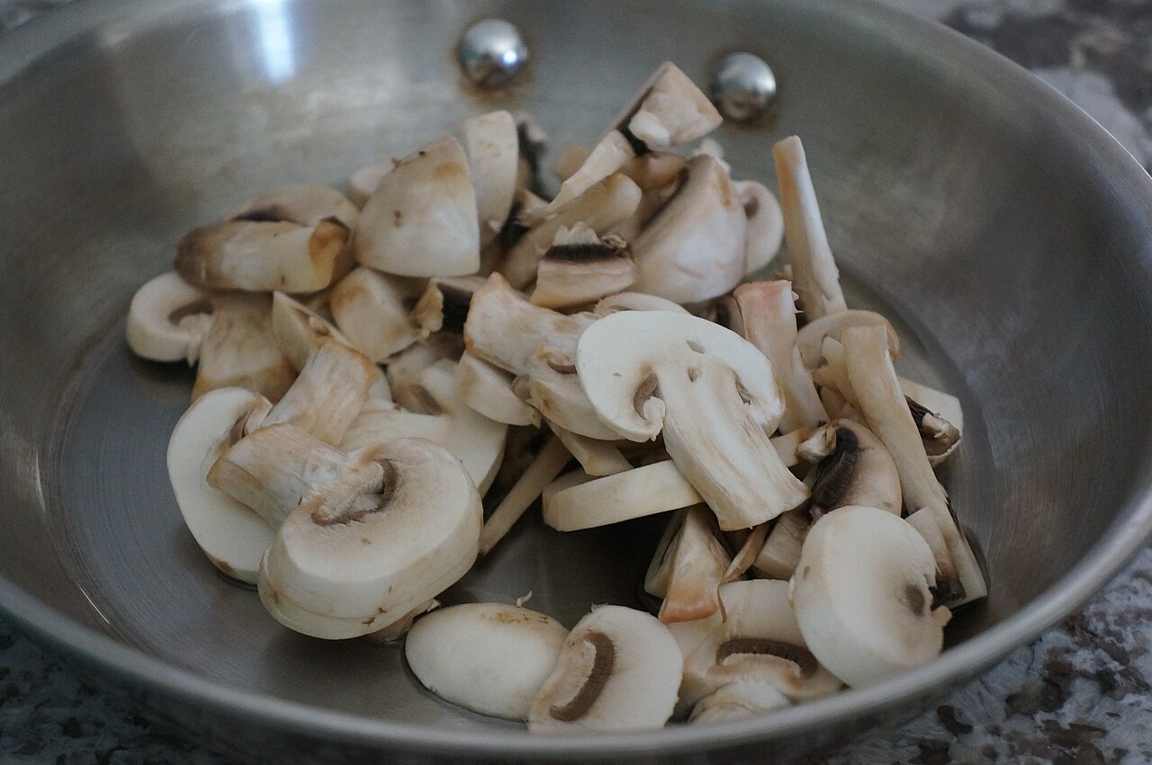 Sliced fresh mushrooms ready for freezing