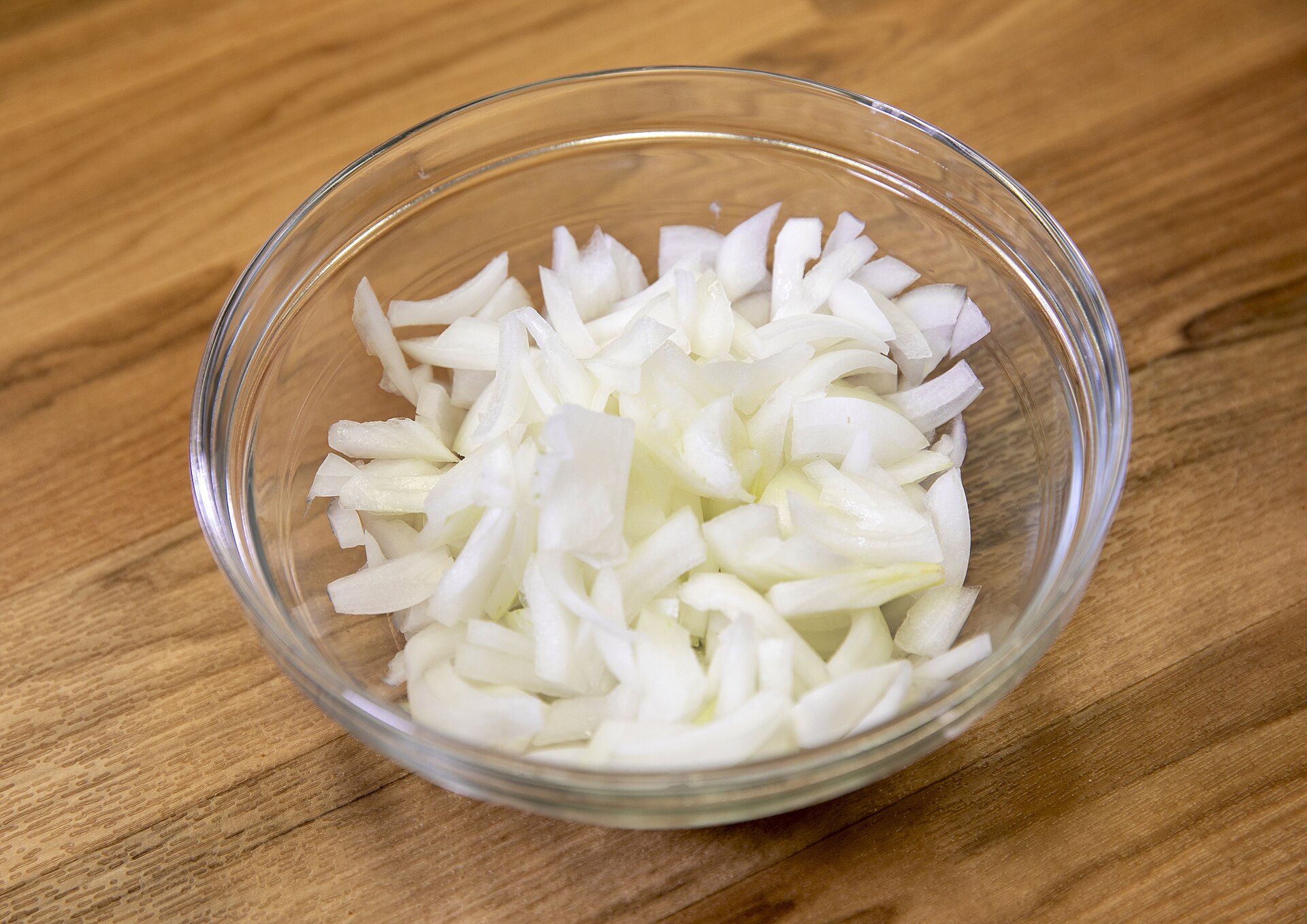Sliced raw onions ready for freezing