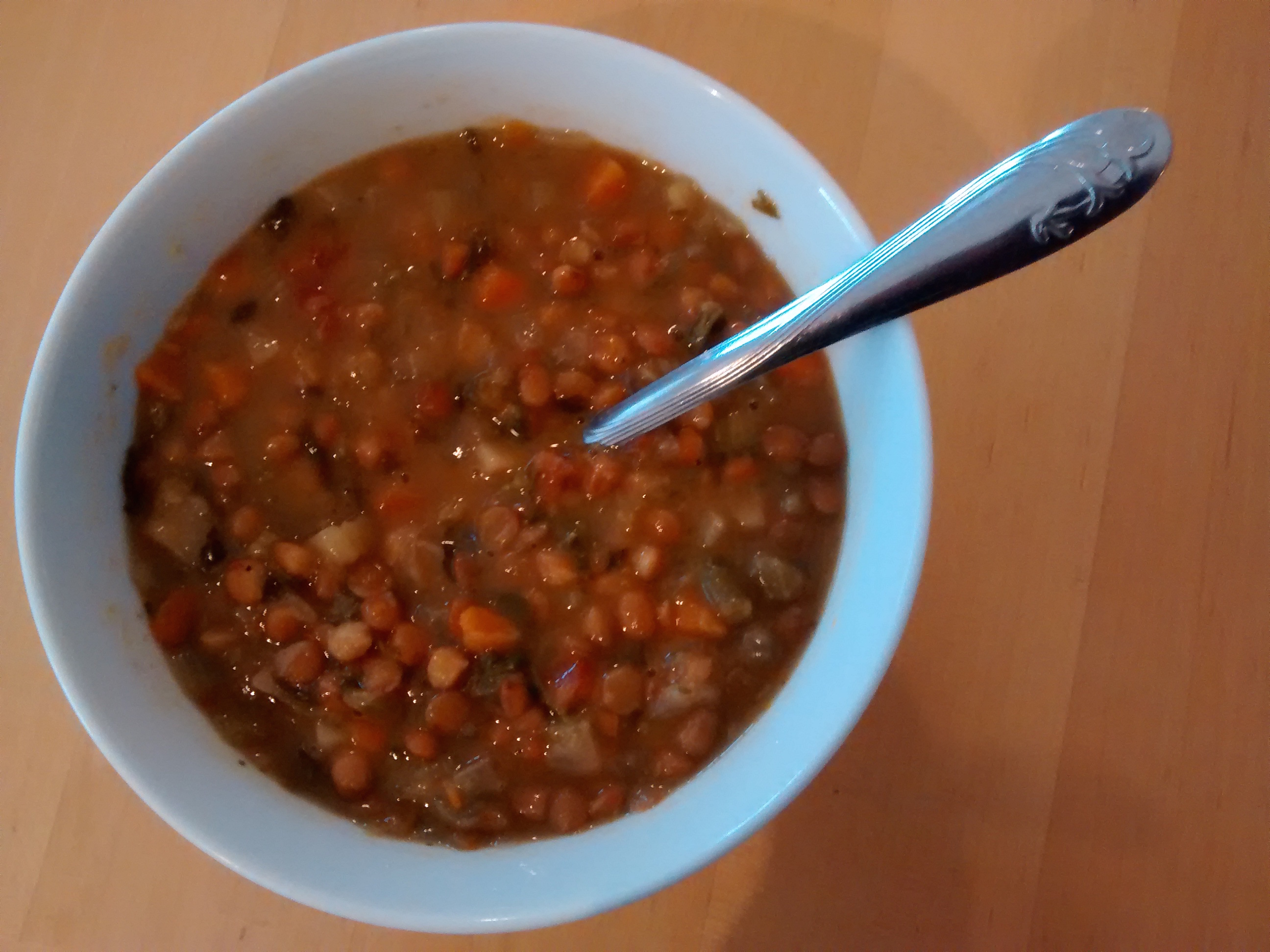 A bowl of thick lentil and vegetable soup
