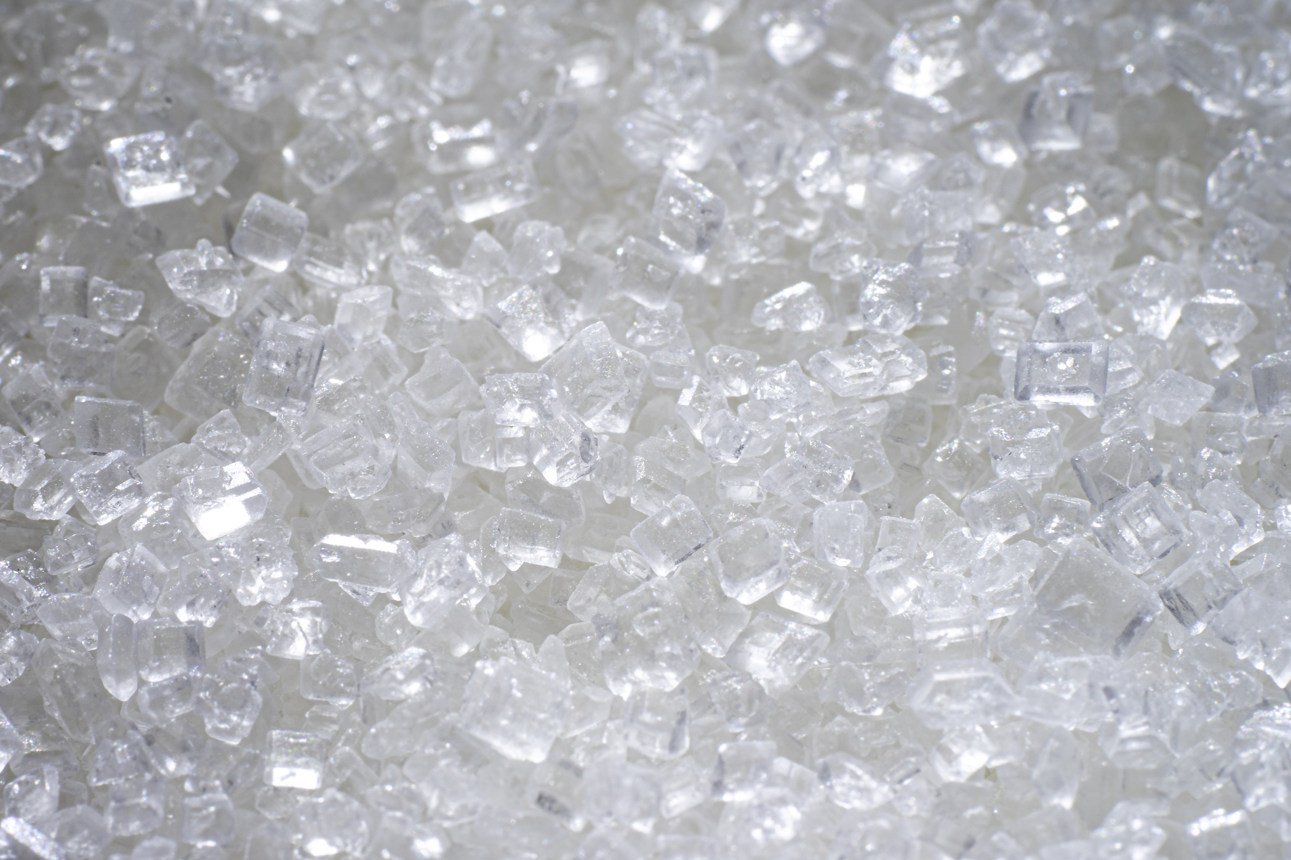 A close-up of white sugar crystals