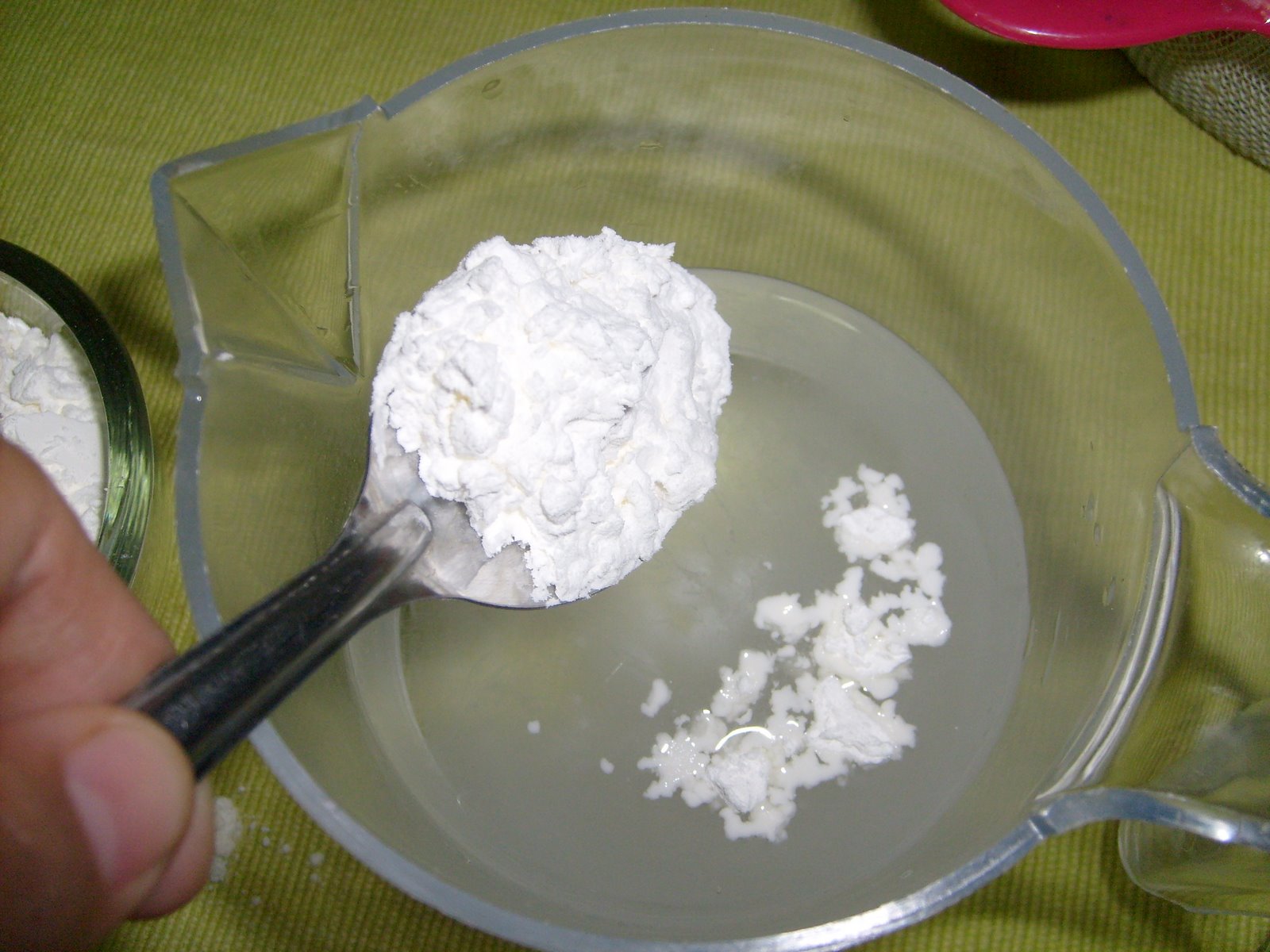 Cornflour being mixed with water into a slurry