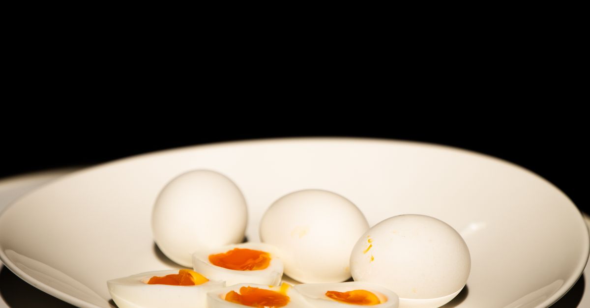 Hard-boiled eggs on a white plate