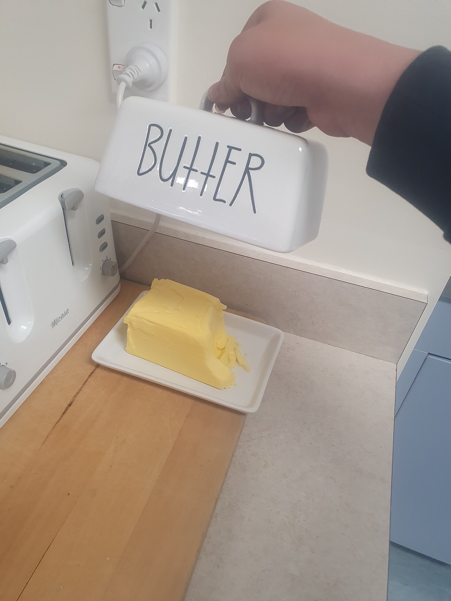 A block of butter in a butter dish