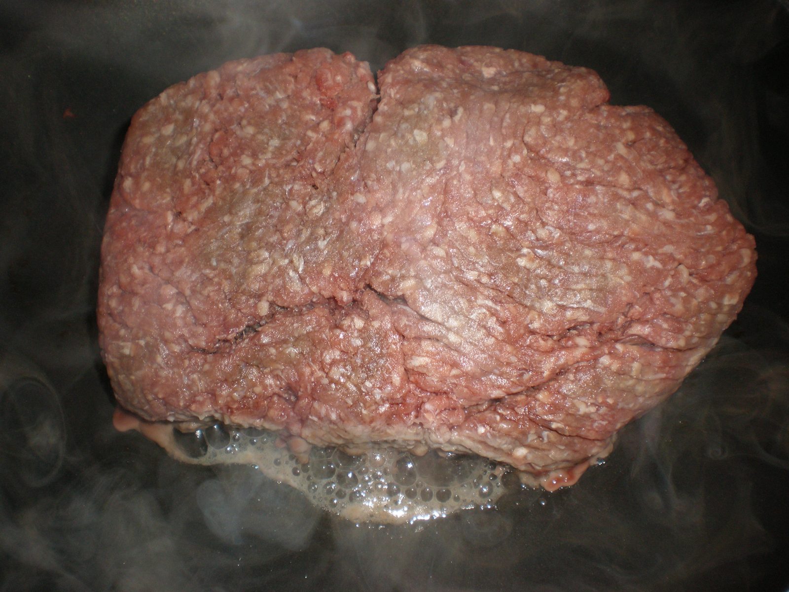 Minced beef browning in a frying pan
