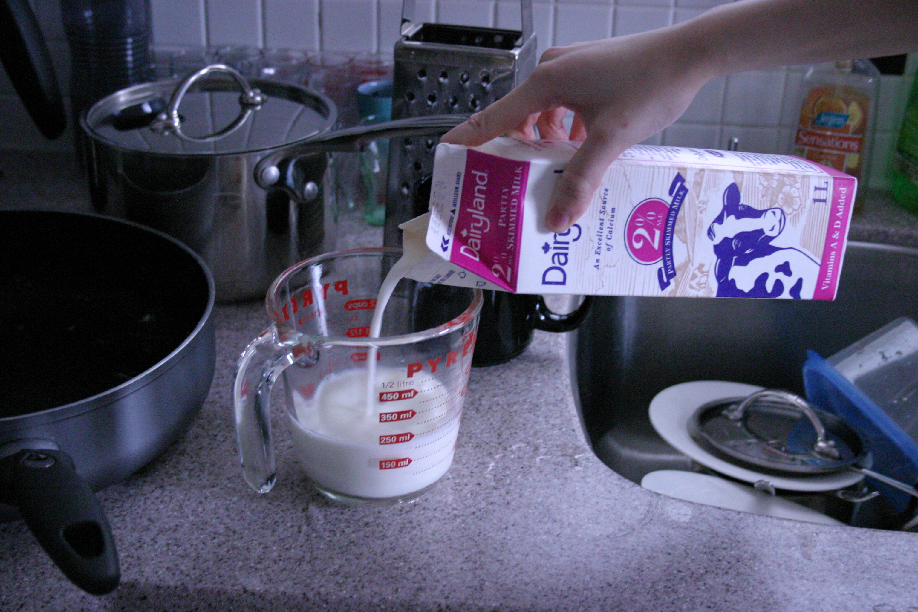 Milk being poured into a glass