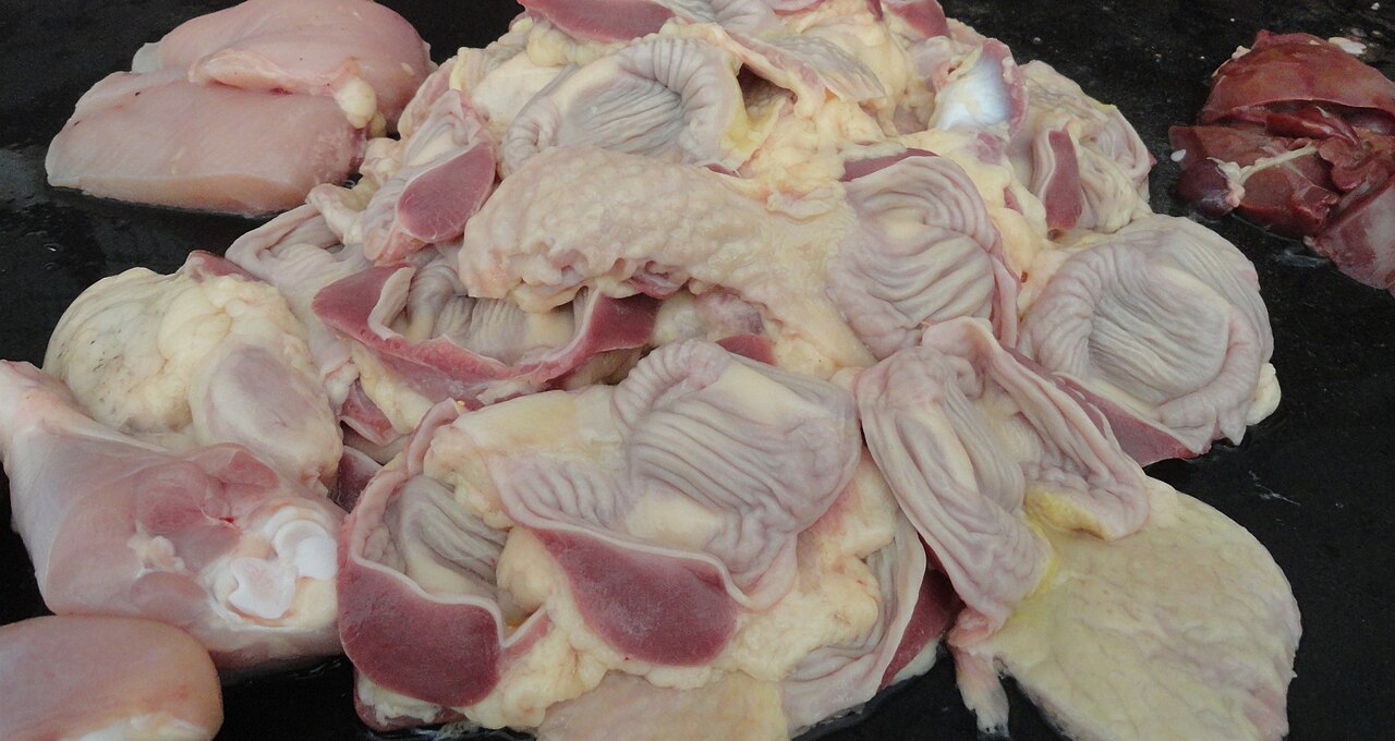 A whole raw chicken ready for cooking