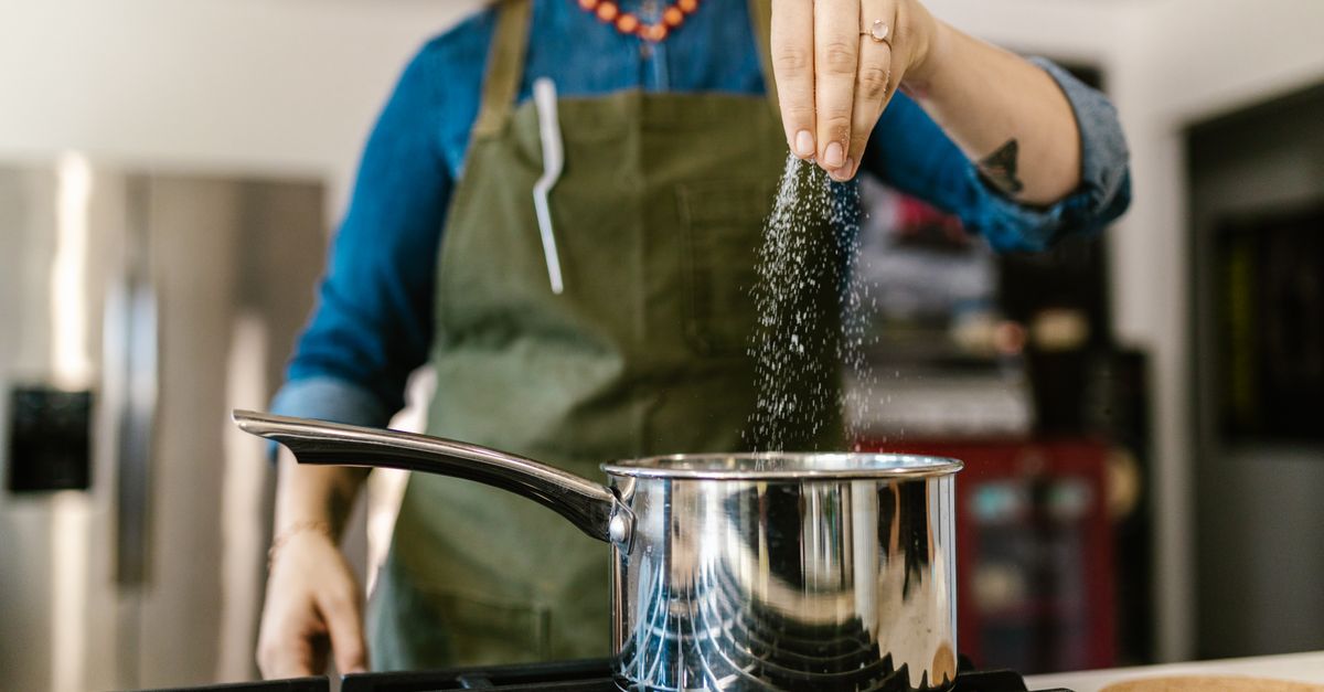 Seasoning a dish on the stove