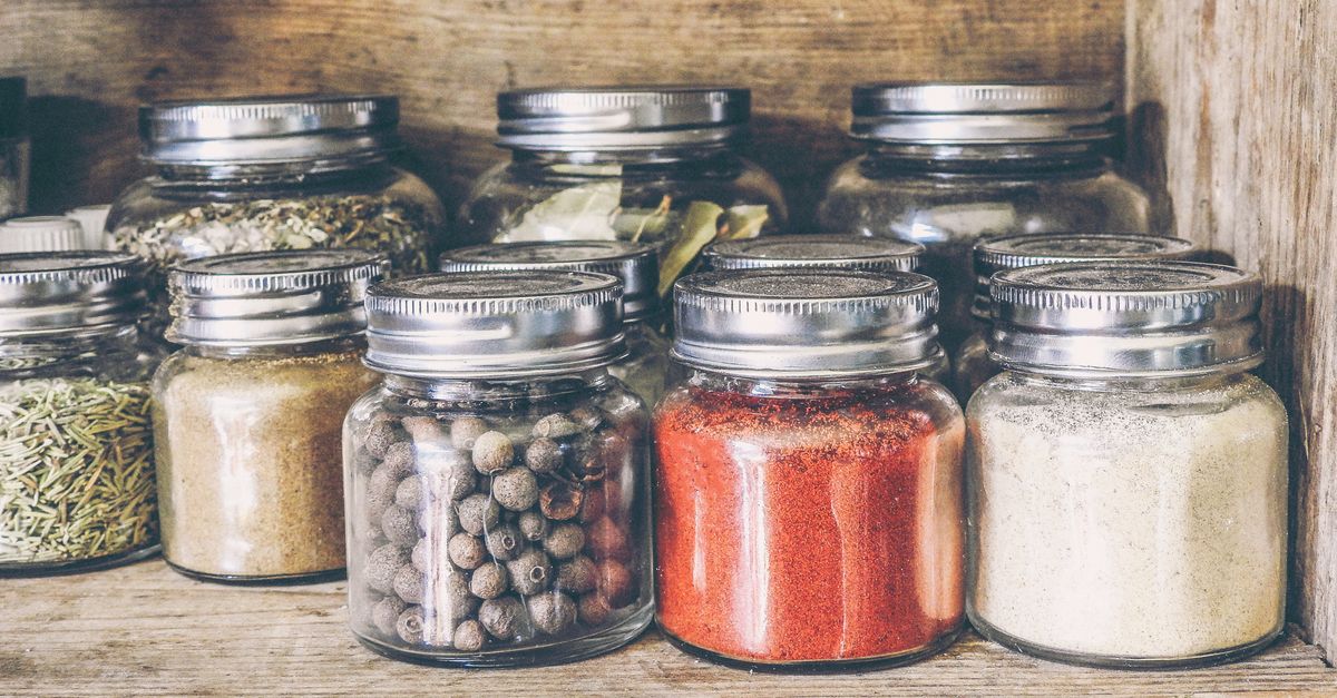 Spices in glass jars on a shelf