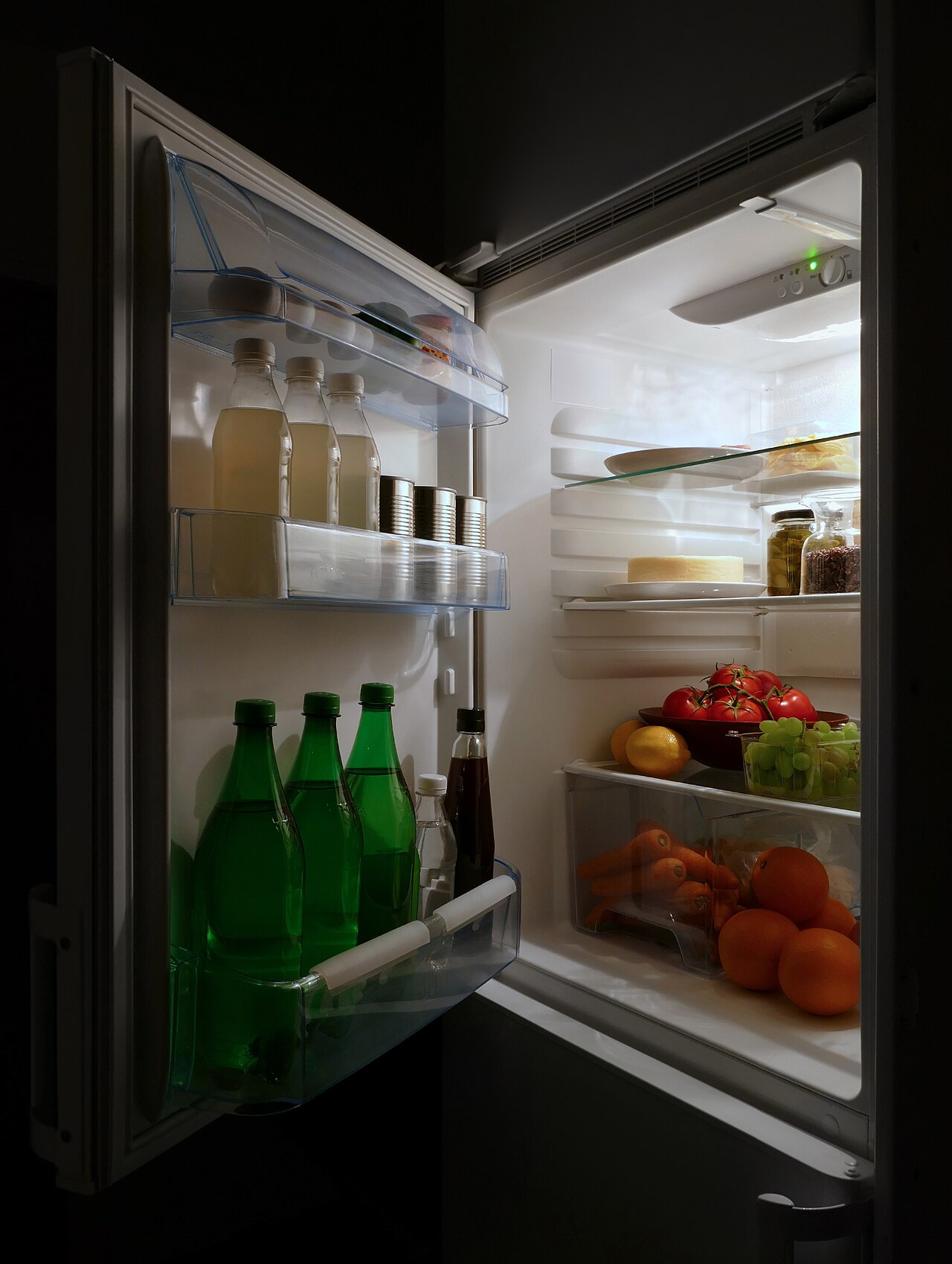 The open door of a well-stocked domestic fridge